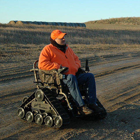 Person using tracked wheelchair on a hunt