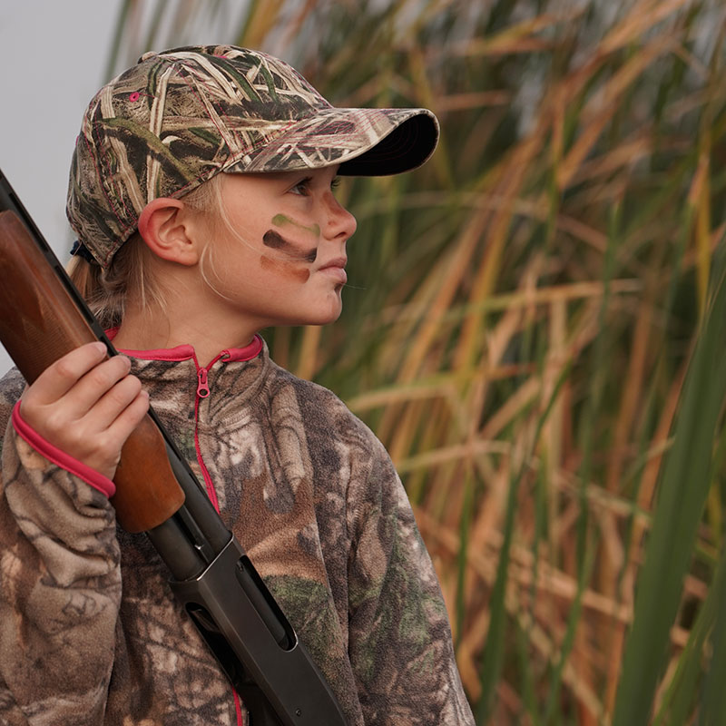 Young girl duck hunting