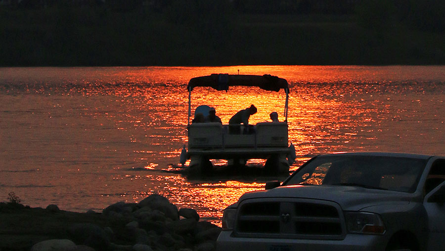 boat on water at sunset