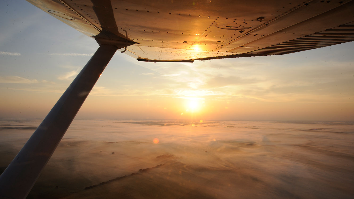 View of sunrise from plane