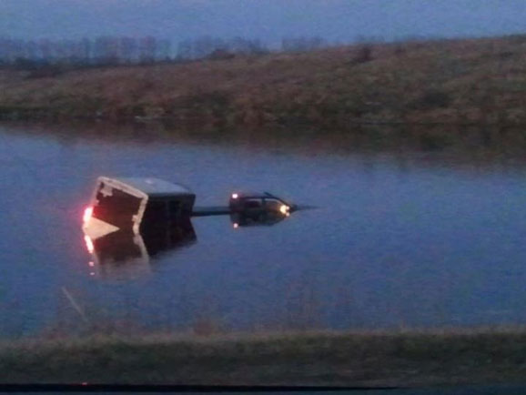 Truck and trailer in the water