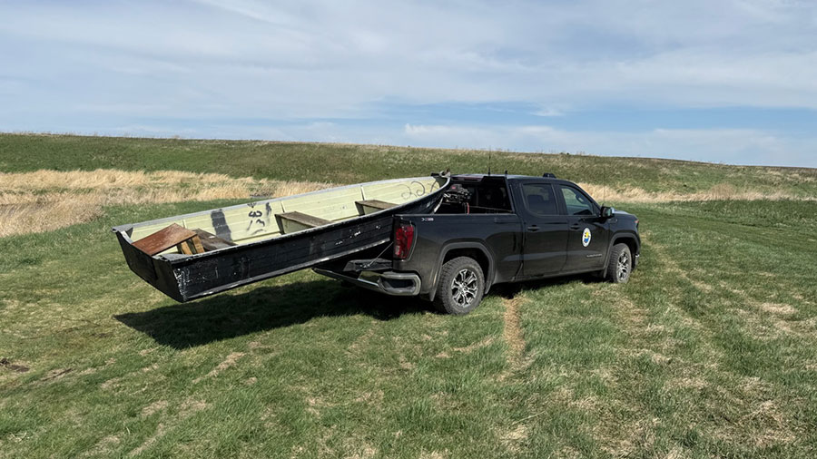 Boat in the back of the warden truck