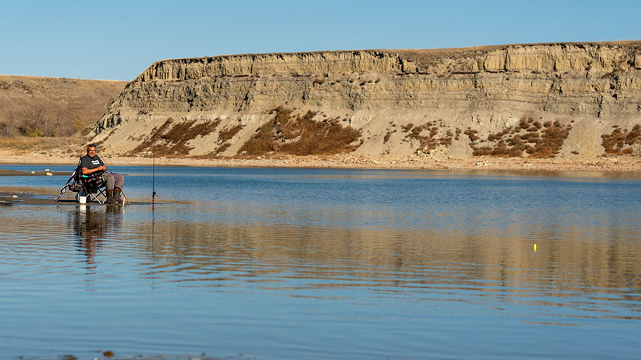 Woman fishing with guide cover superimposed