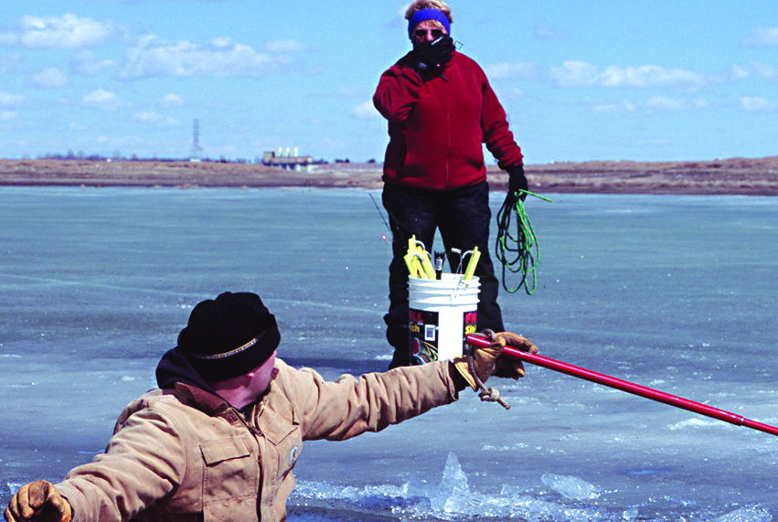 Woman looking at man who fell throught the ice