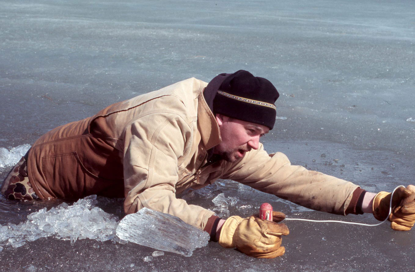 Person using ice picks to get out of water - 2