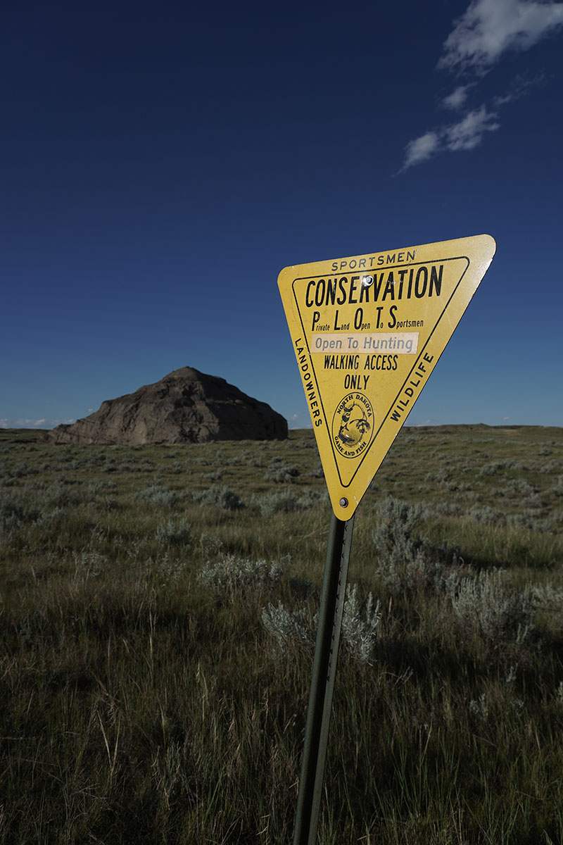 PLOTS sign in badlands