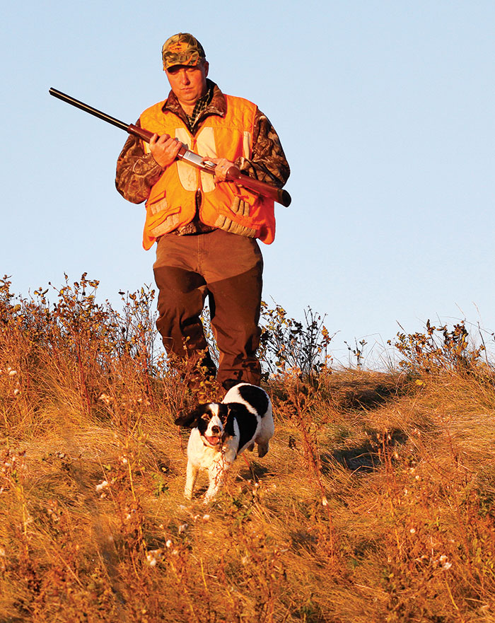 Hunter walking with dog