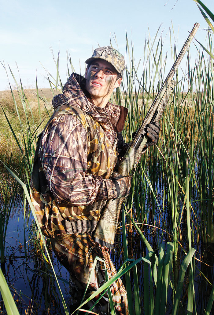 Waterfowl hunter with dog