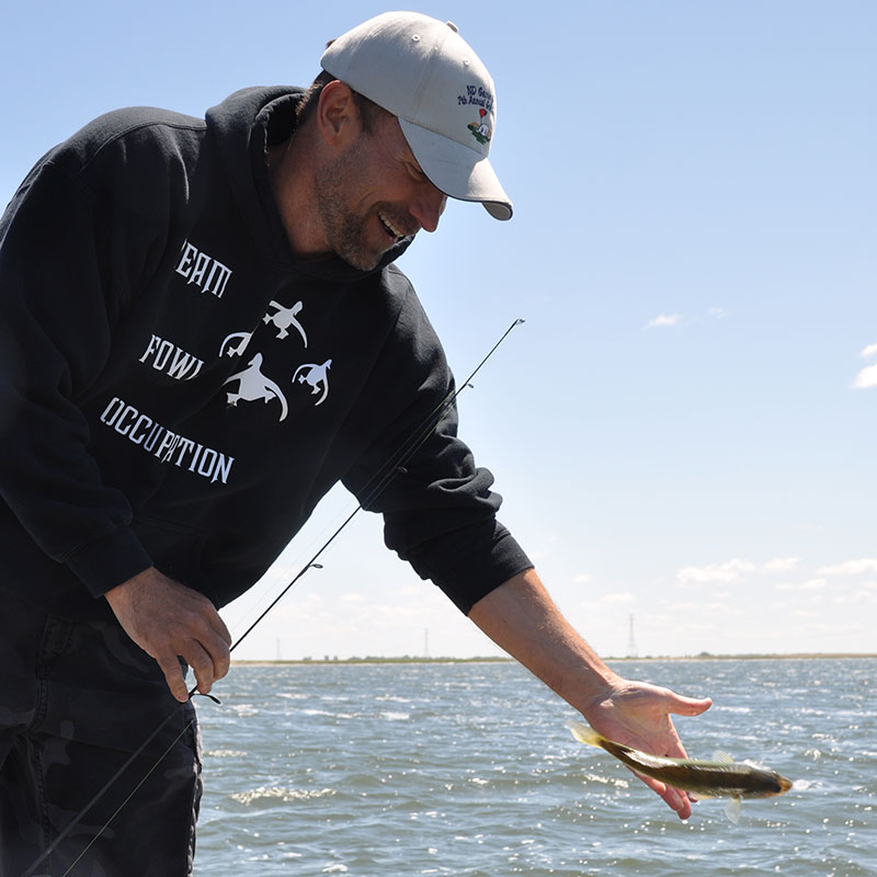 Man releasing fish