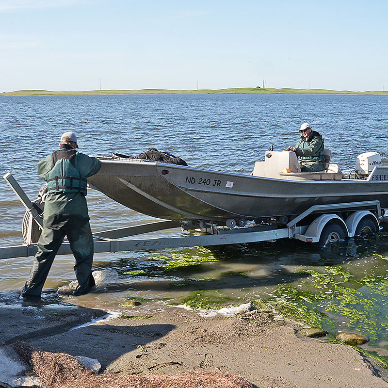 Department employees launching boat