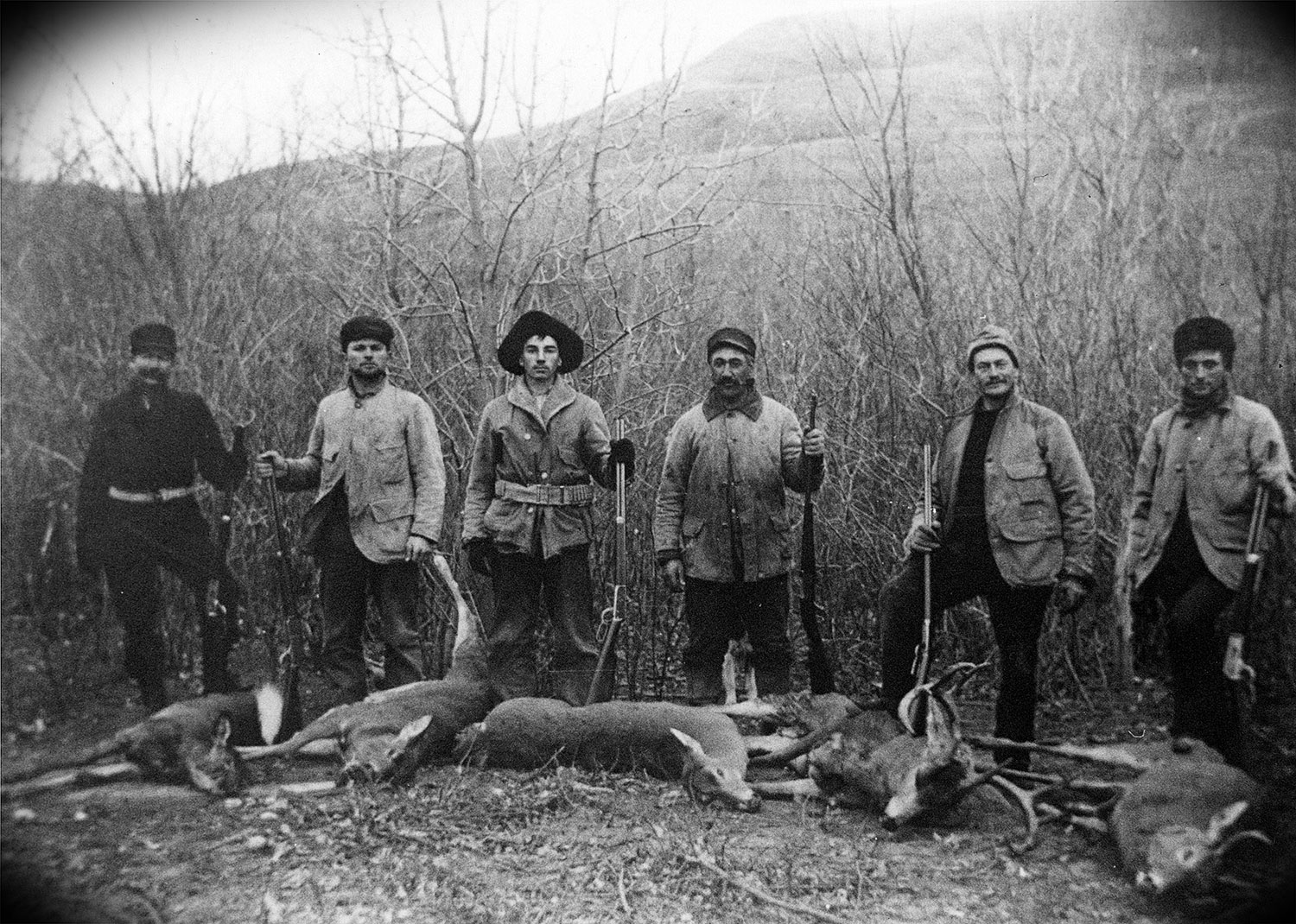 Hunters with deer