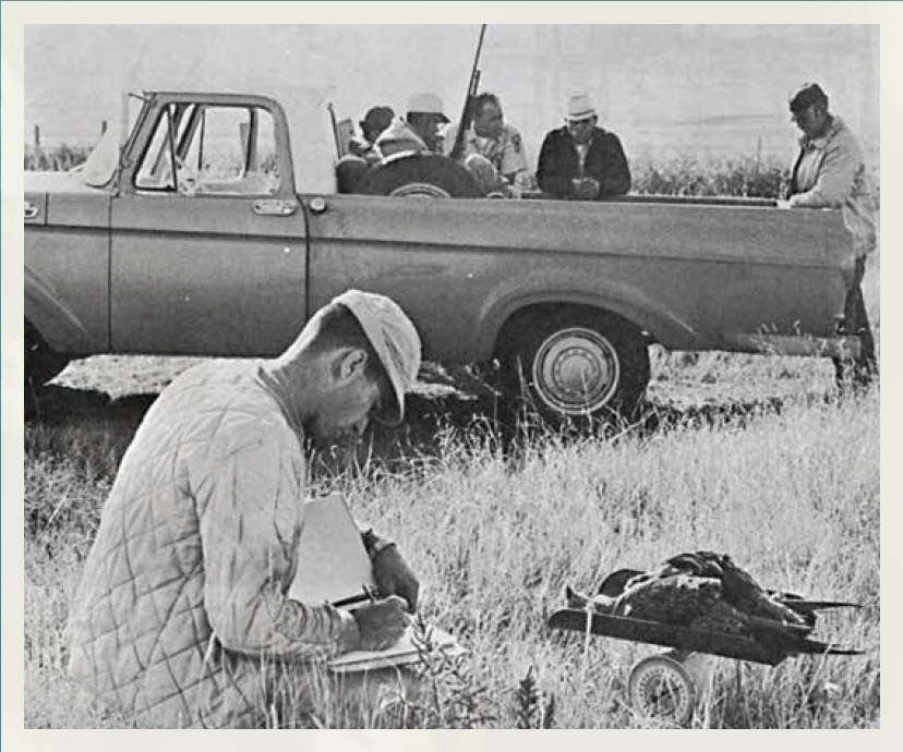 1964 photo of hunters and biologist