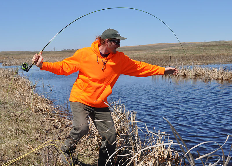 Angler catching pike