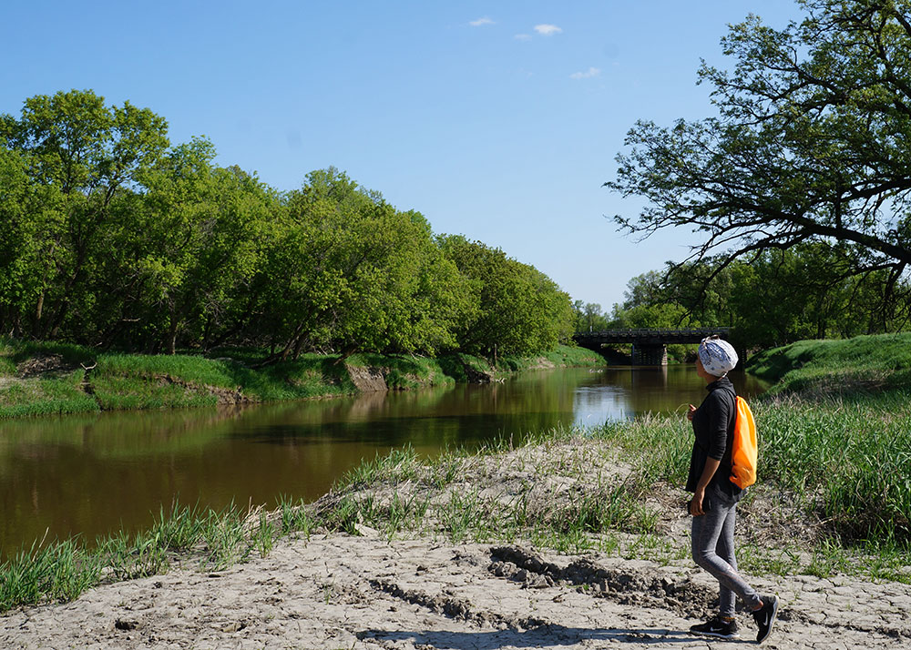 Hiker by river