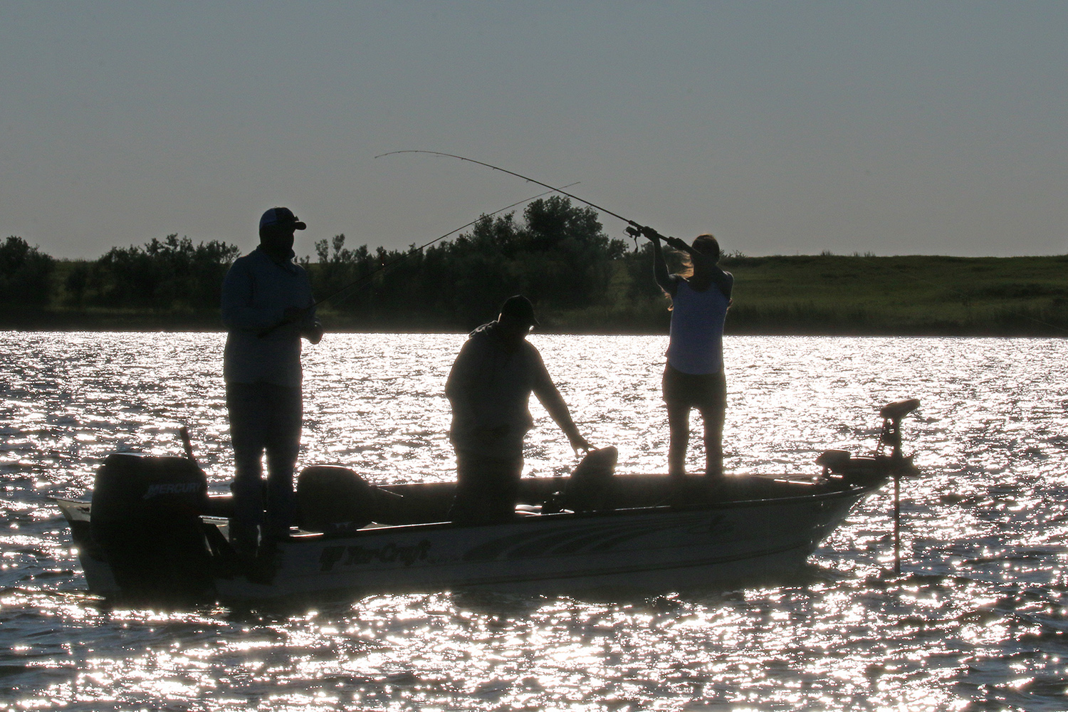 People on a boat fishing