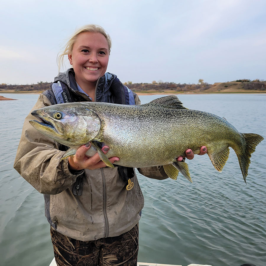 Fisheries staff holding salmon