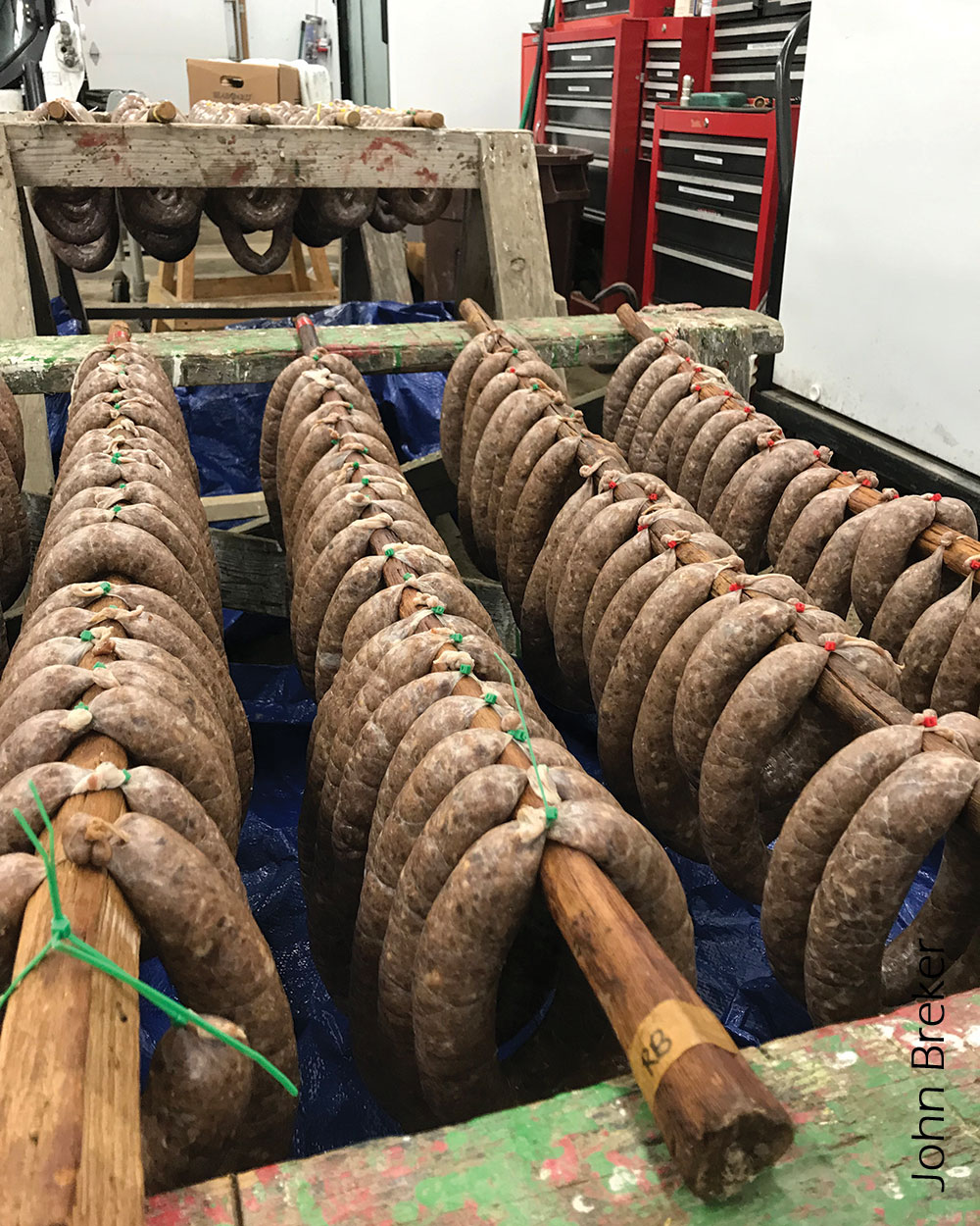 Sausage on racks in smokehouse