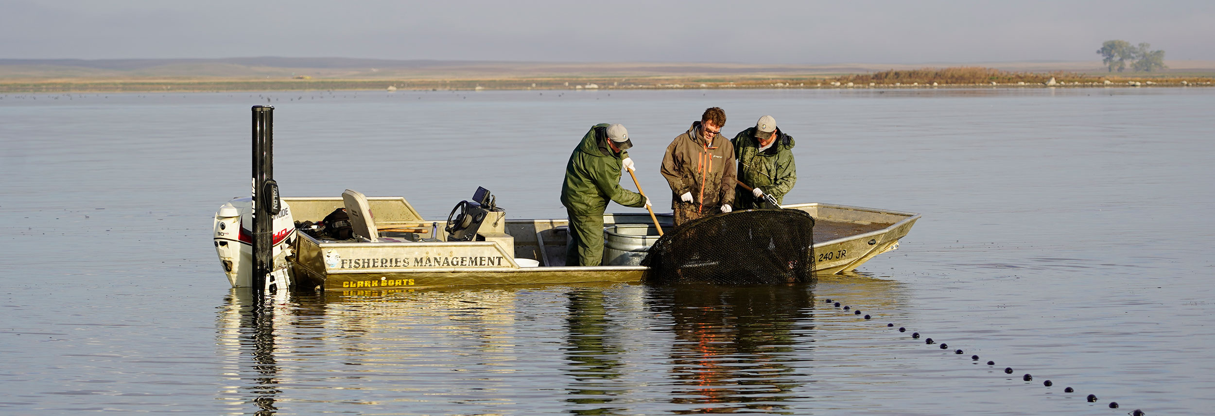 Staff netting fish