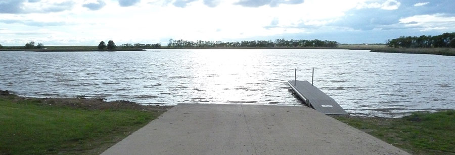 Looking down a boat ramp on a prairie lake