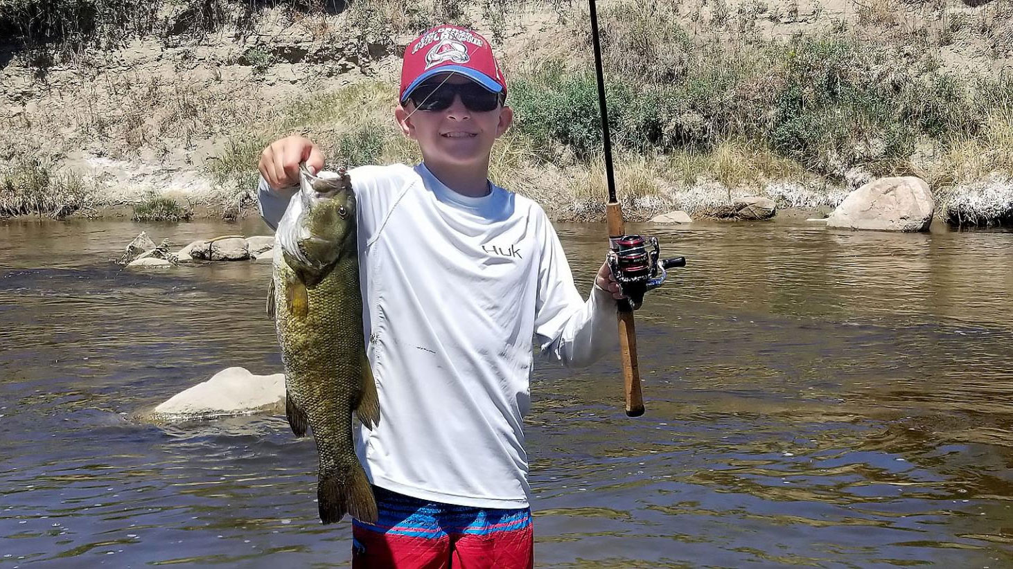 Angler holding fish caught shorefishing