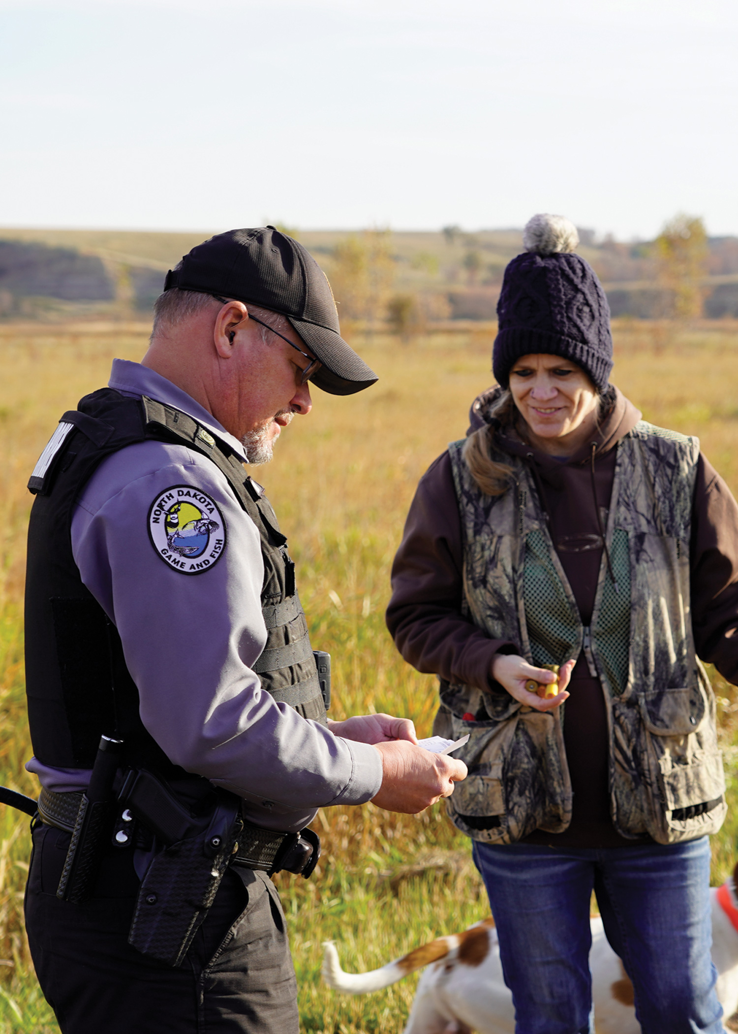 Game warden checking an hunter's harvest