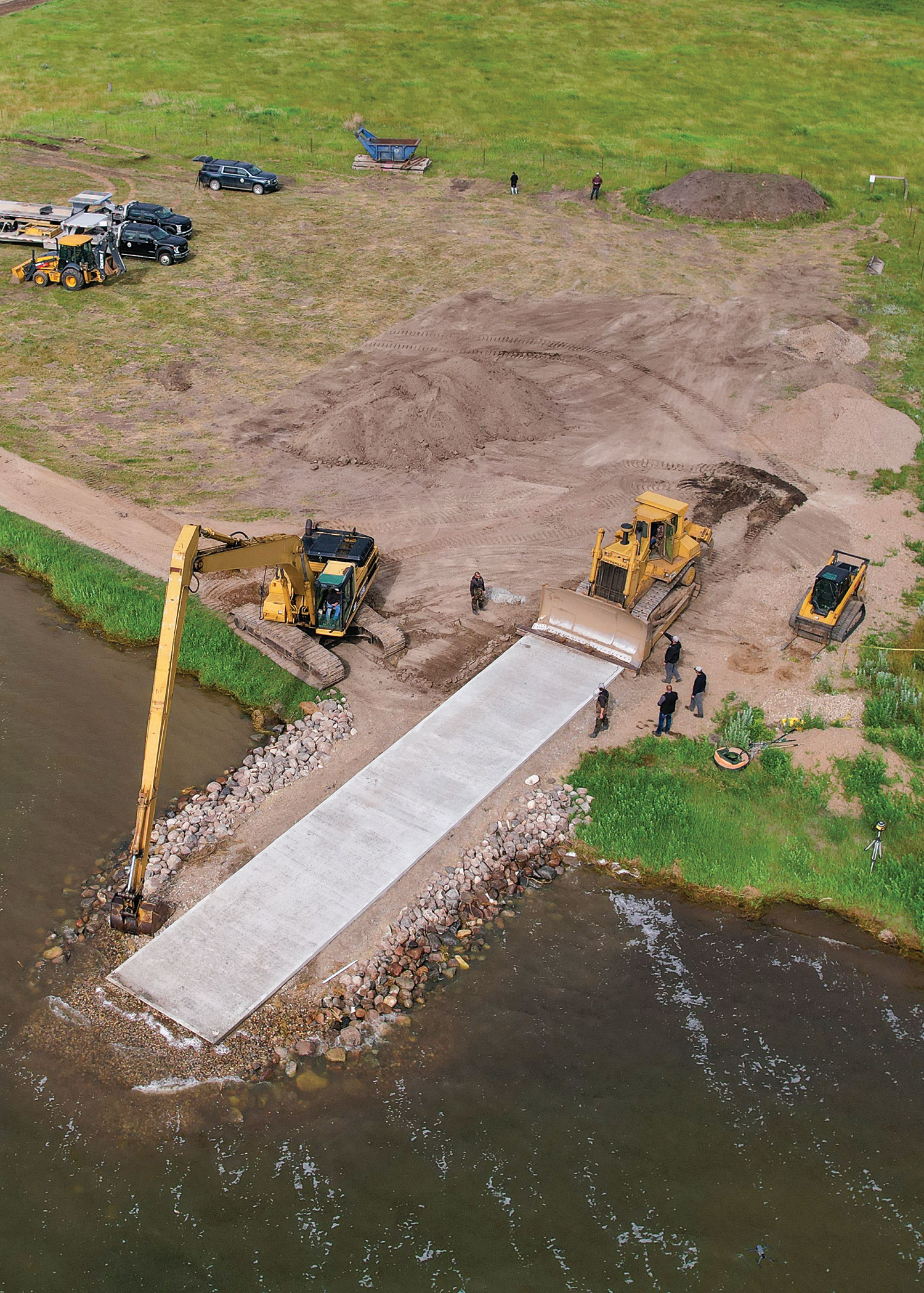 Large machinery working on ramp seen from drone
