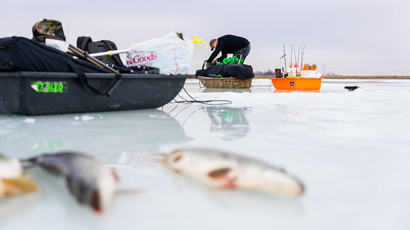 Angler in background on ice