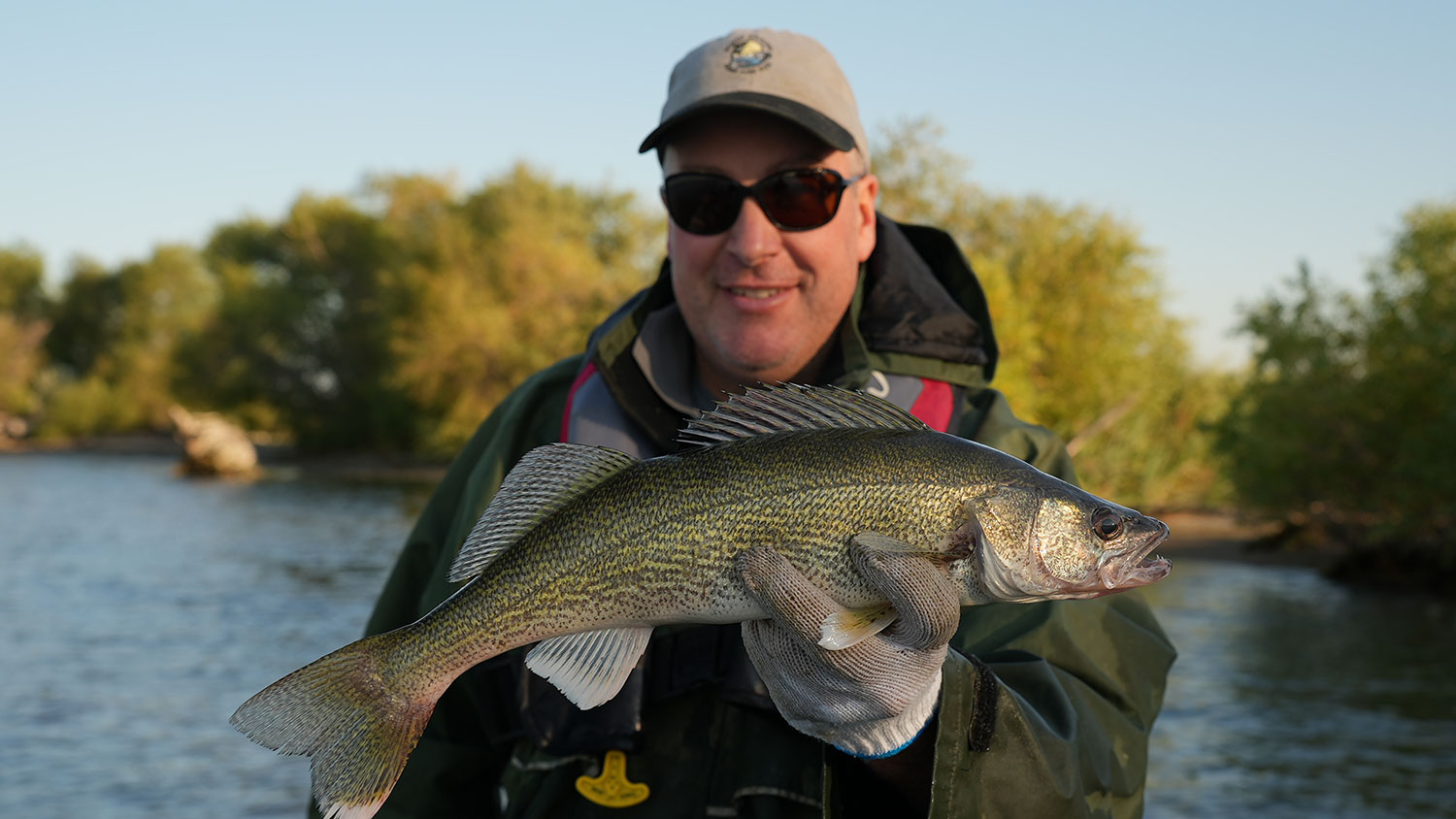 Biologist holding walleye