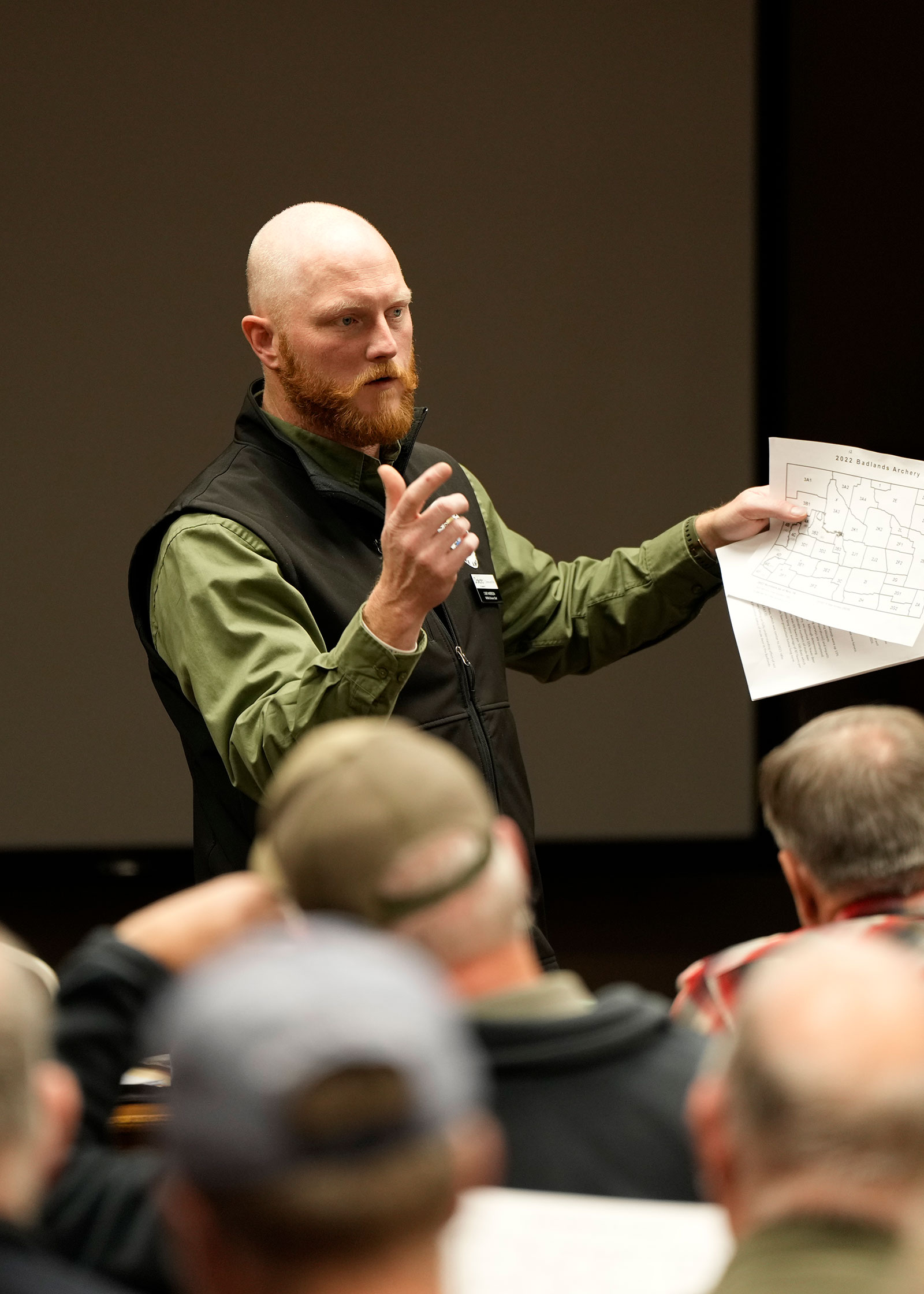 Casey Anderson speaking at a meeting