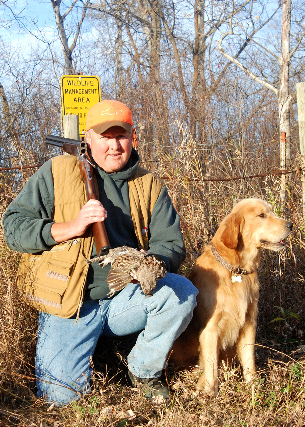 Peterson posing with harvested upland game