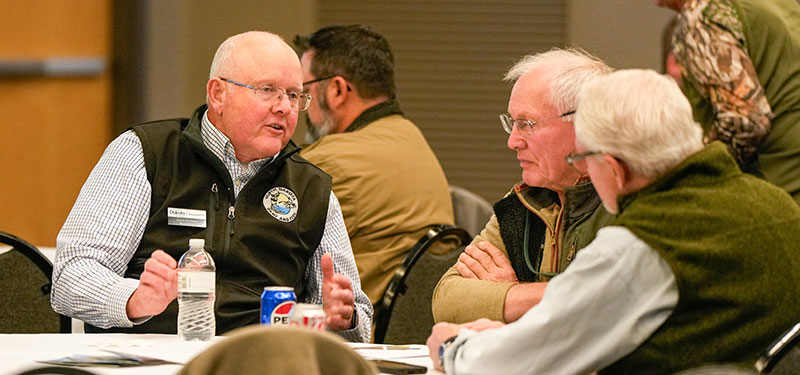 Peterson talking to participants at a habitat summit