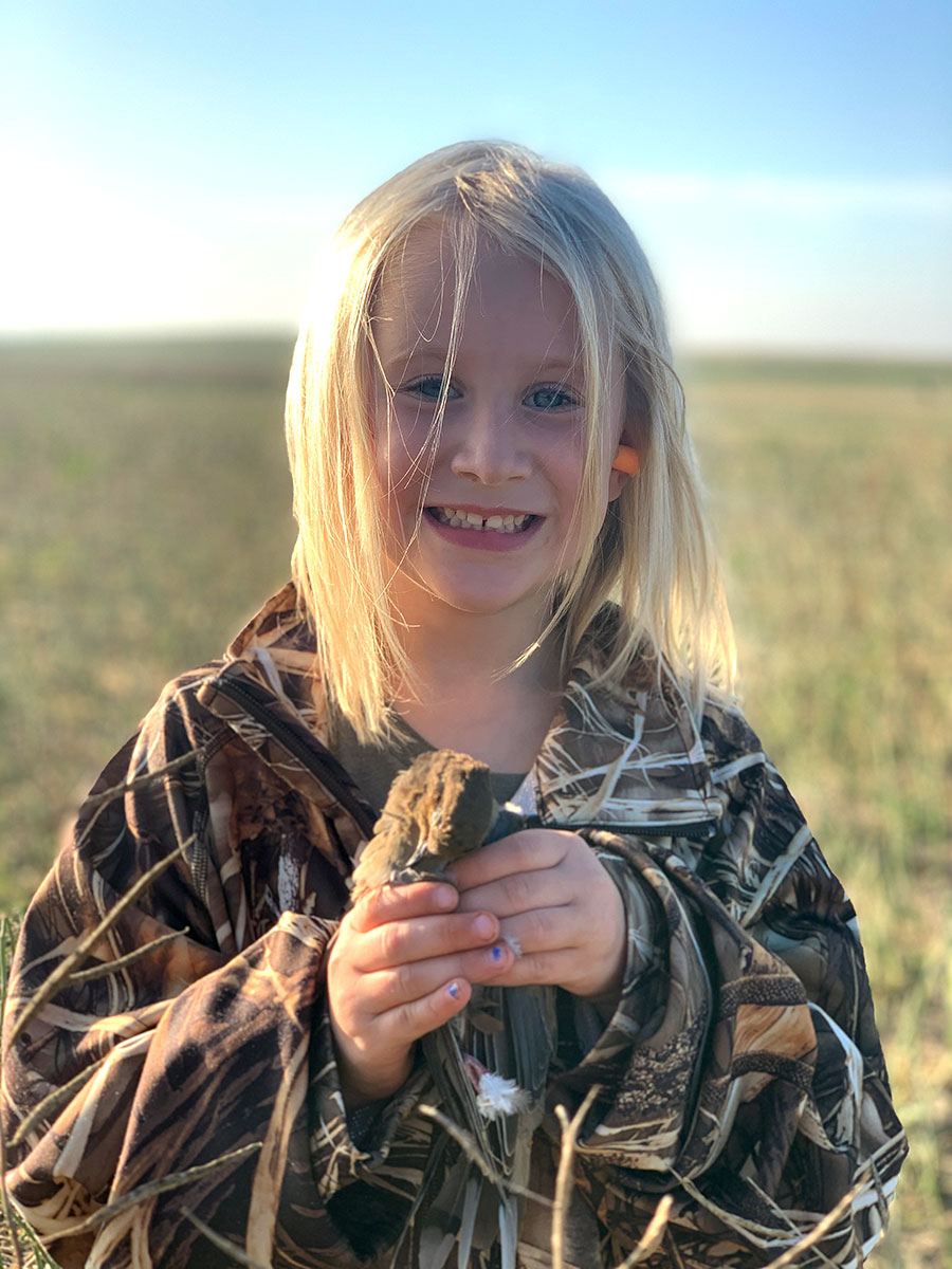 Girl with a dove she harvested