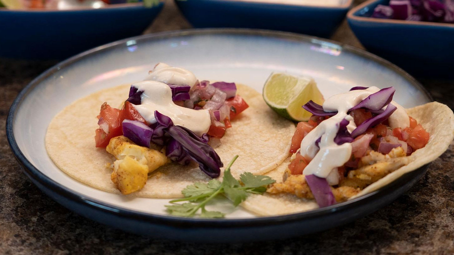 Fish taco on blue and white plate