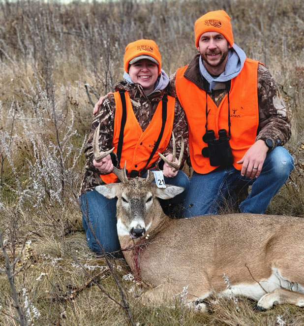 Erin Essler with husband and her first deer