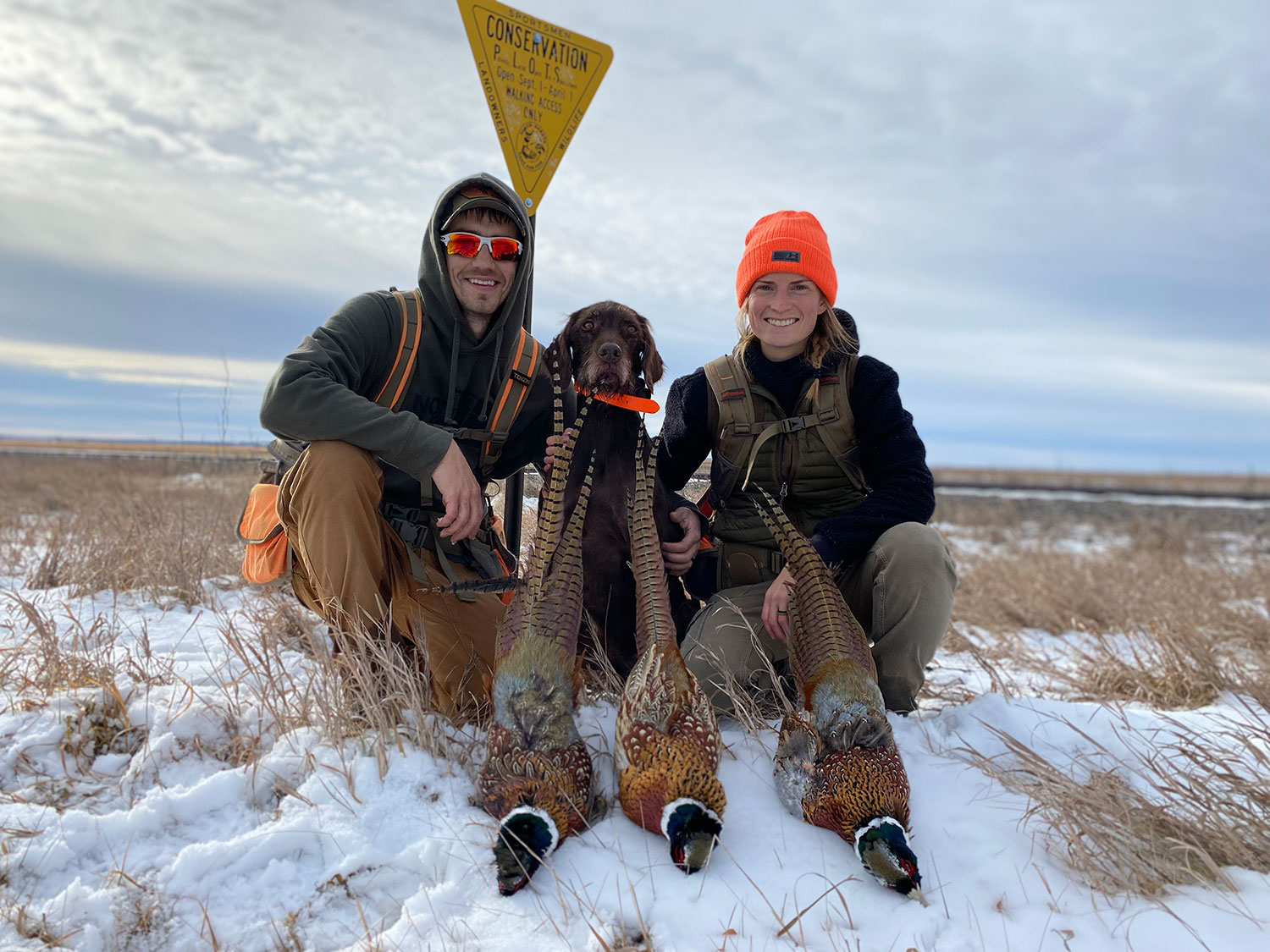 Cayla with husband and Fin after a successful hunt