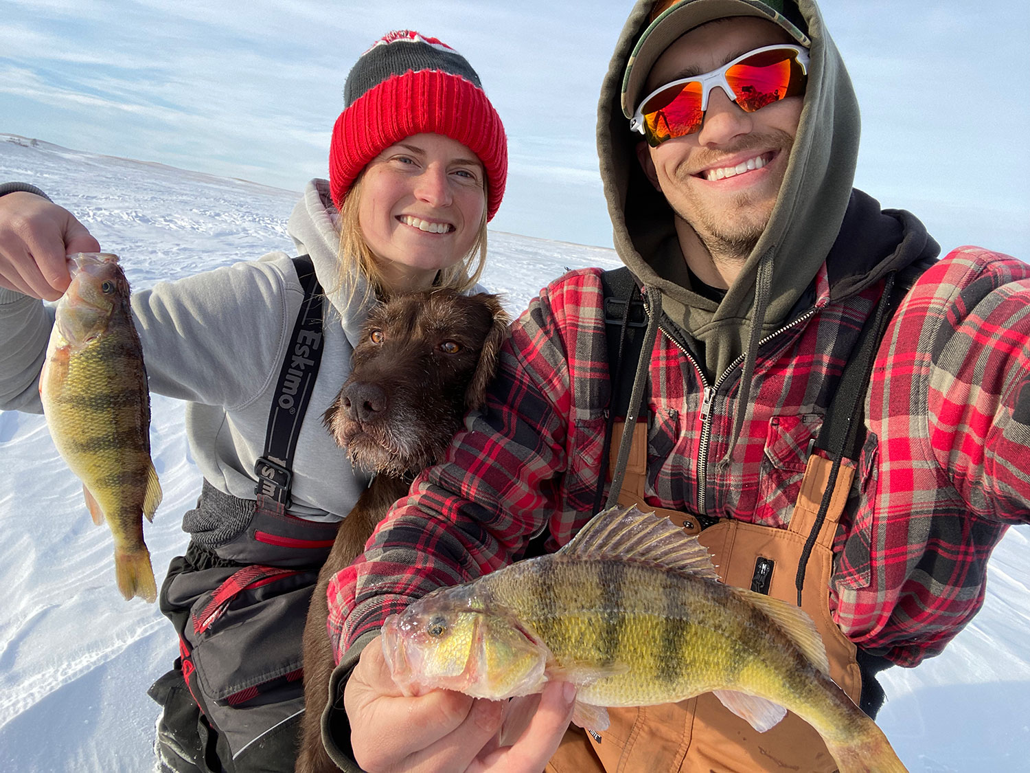 Cayla with husband Scott and dog Finley