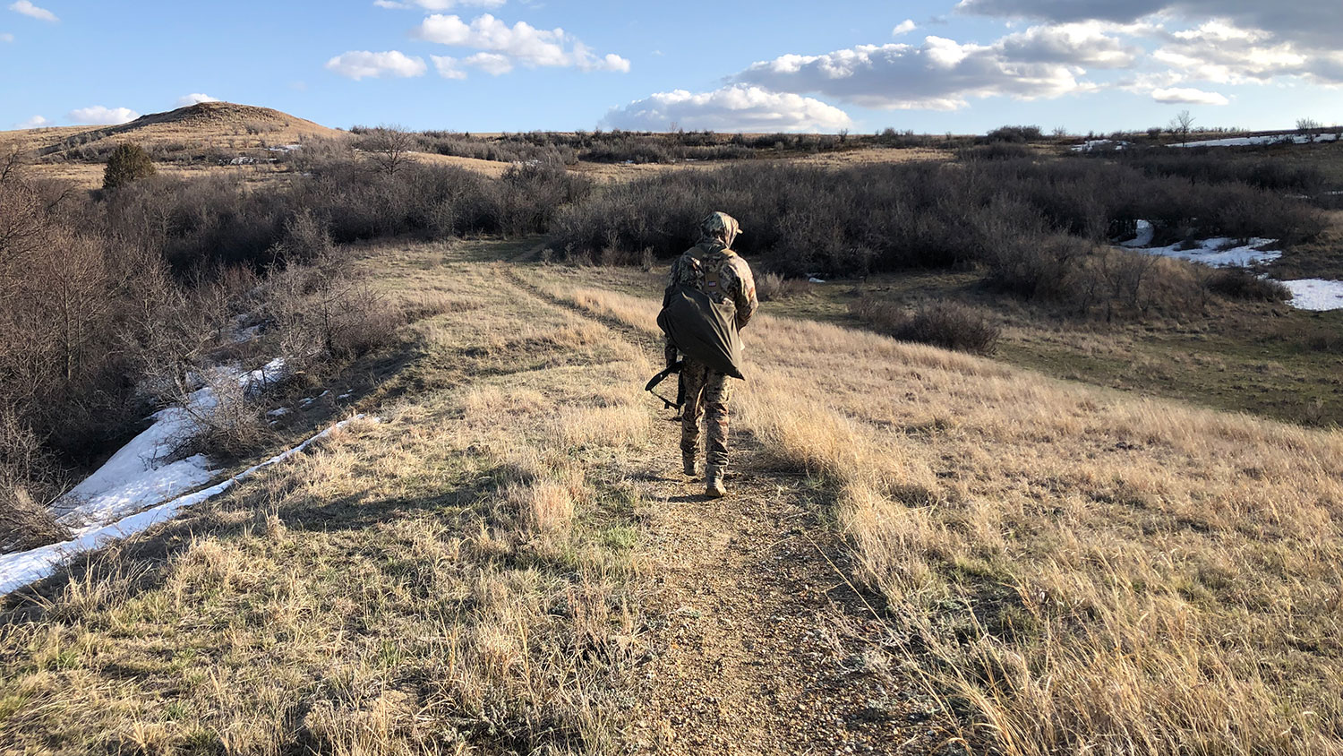 Hunter walking in the badlands