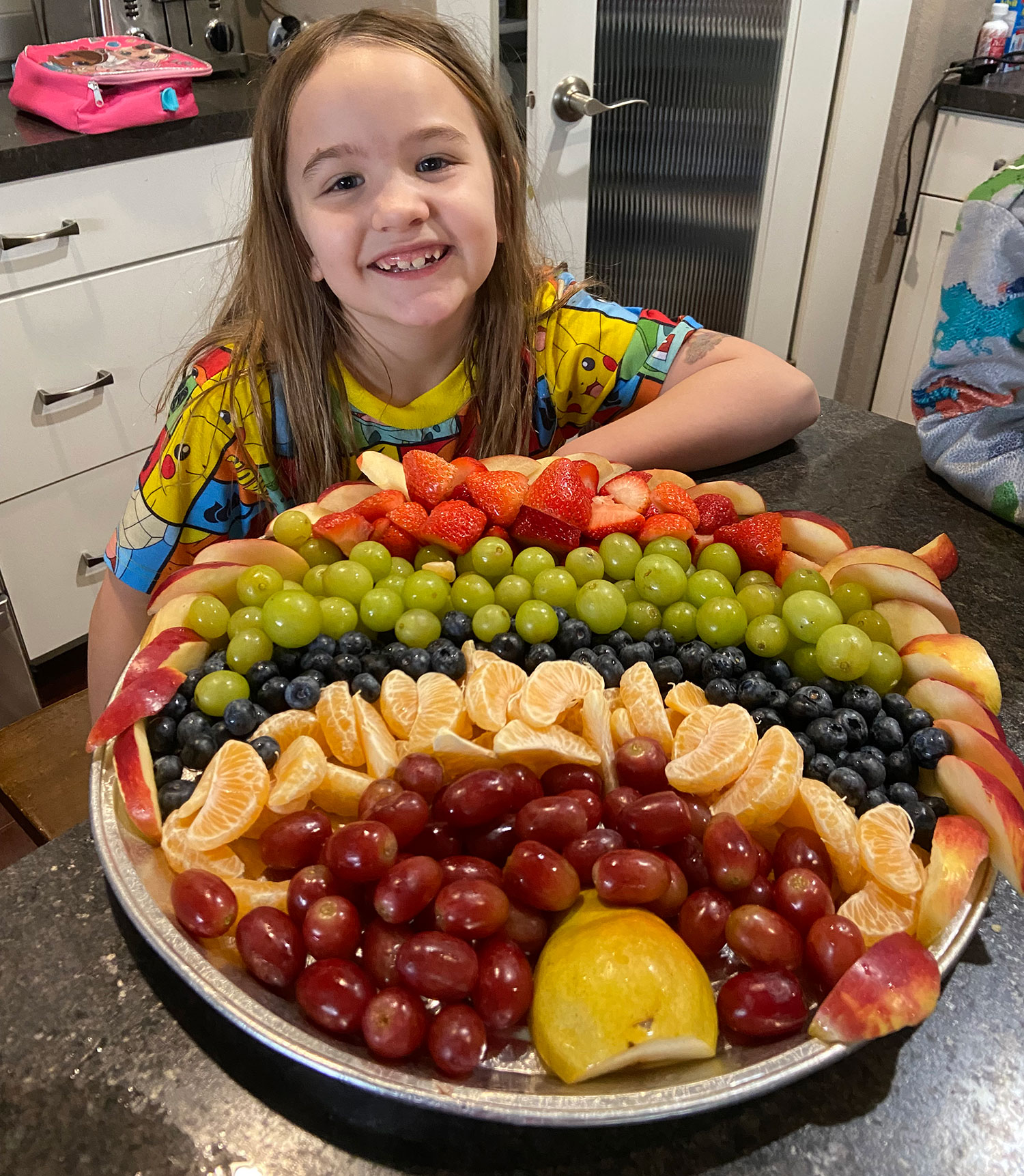 Jackie's daughter displaying a fruit turkey
