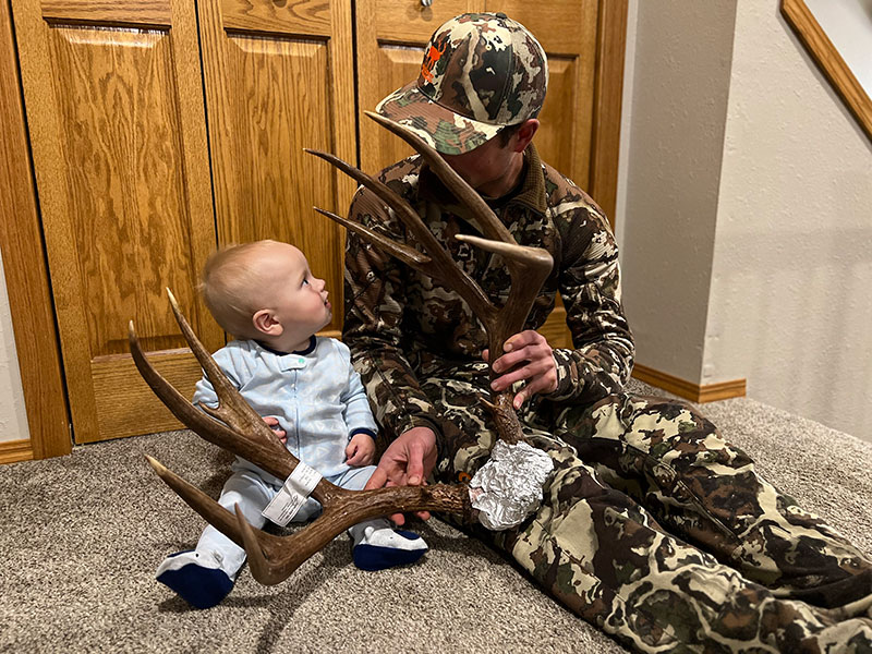 Fischer with his uncle showing him the antlers from his deer