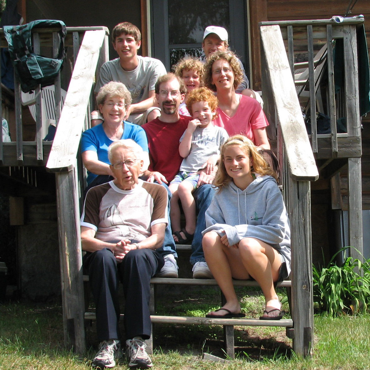 The family on the steps of a cabin