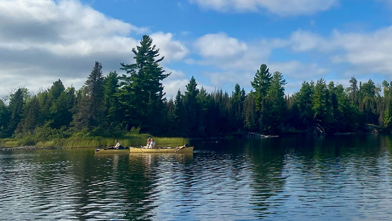 Author canoing down river