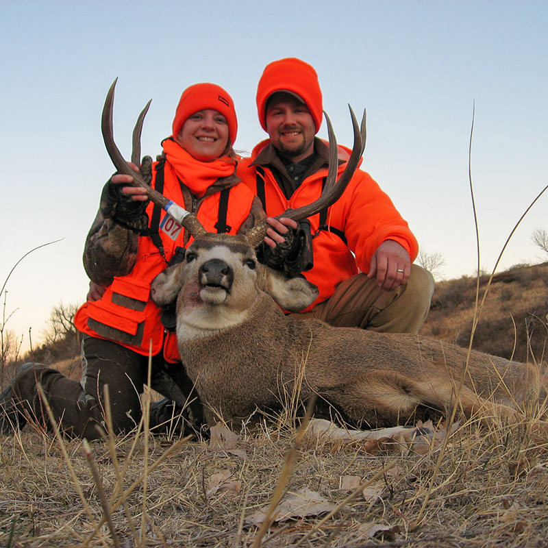 Sandy and her husband with a mule deer buck Sandy shot.