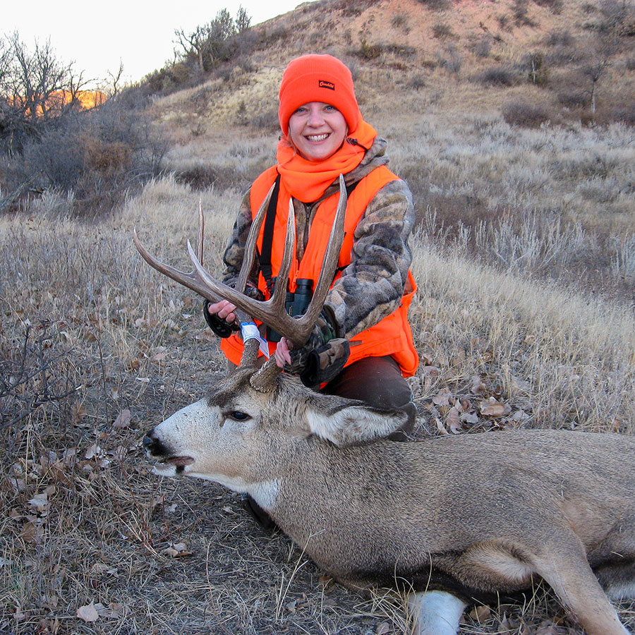 Sandy with a mule deer buck she shot.