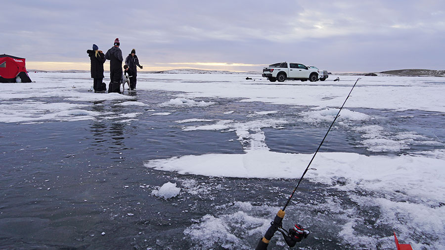 People ice fishing