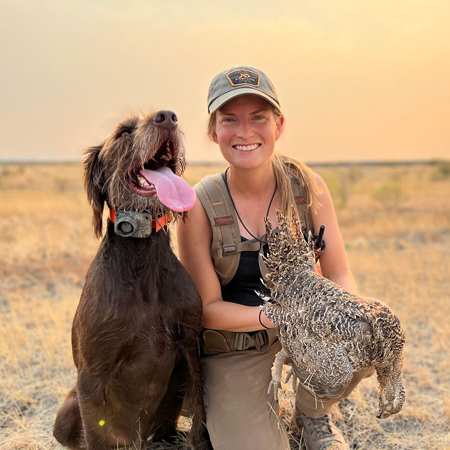 Finley with Cayla and a harvested grouse