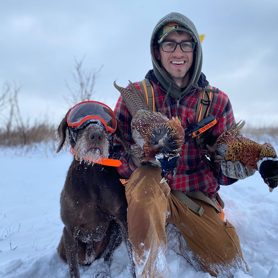 Finley and Scott in snow with harvested pheasants