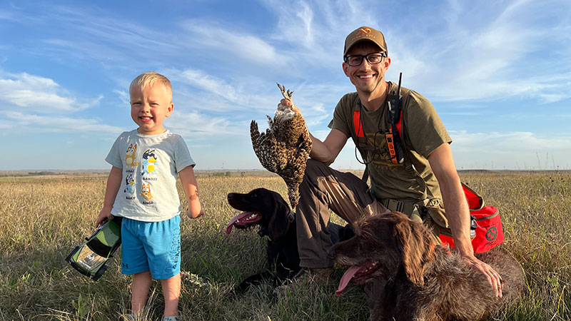 Fisch and Dad with harvested sharptail
