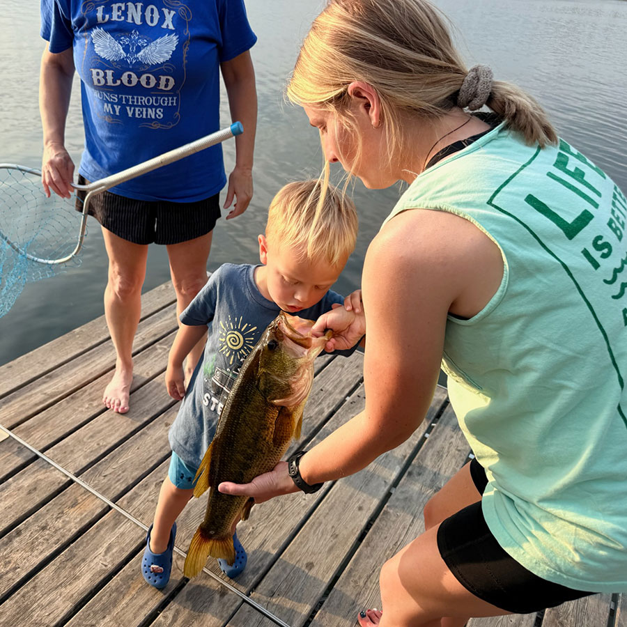 Fischer looking at a fish