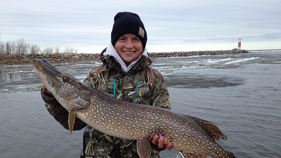 Cayla on boat holding fish