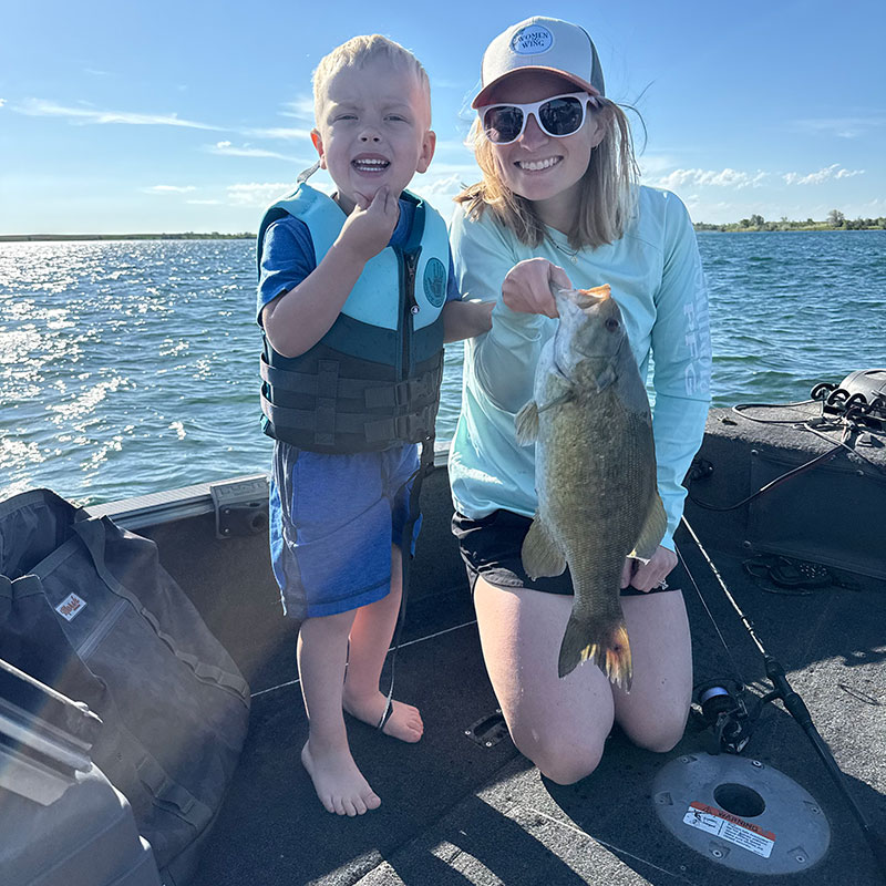 Fisher and Cayla with a fish